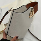 Elegant Beige Bucket Bag. Golden Lock & Adjustable Strap.